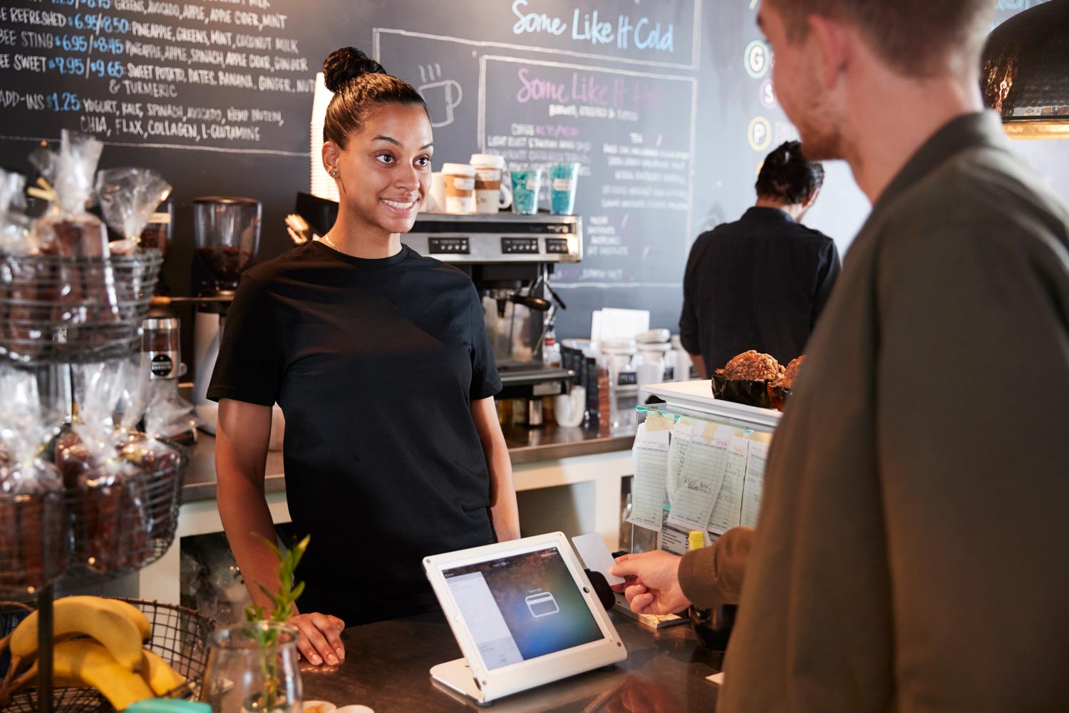 POS-customer-paying-in-coffee-shop-using-credit-card-2024-10-19-06-02-06-utc